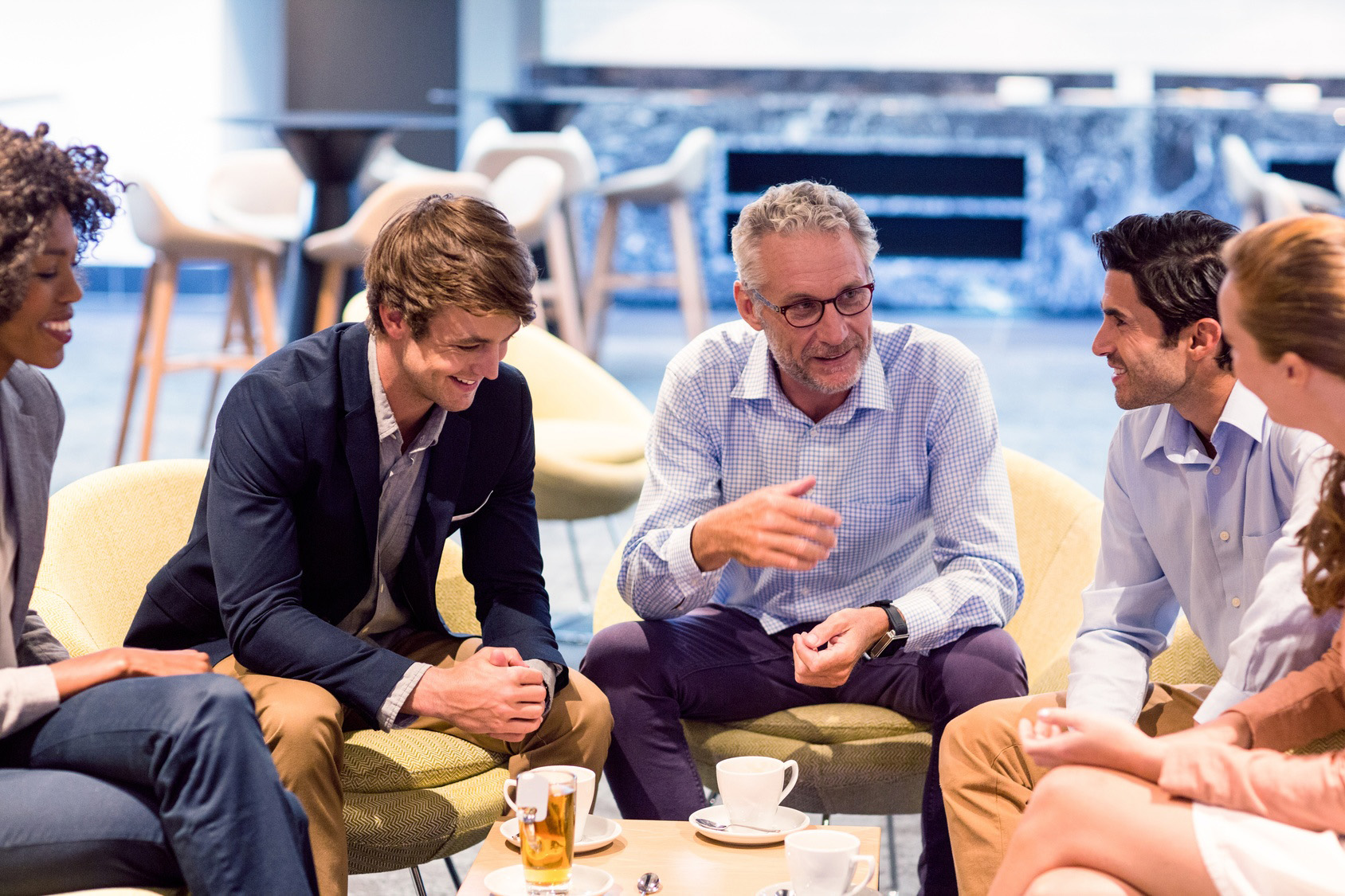 Business people having a discussion in cafeteria